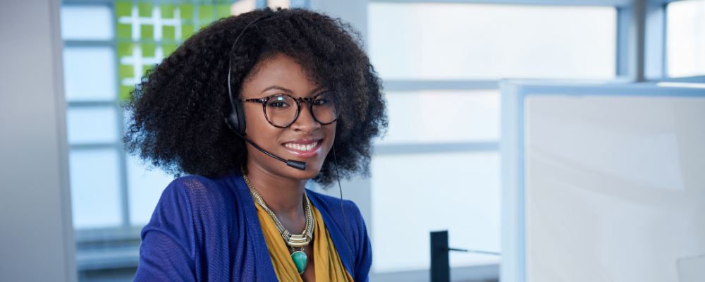 Stock image of a woman presumably taking a Customer Service training course
