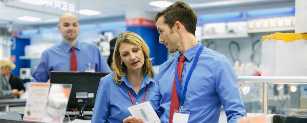 Retail supervisor chats with a team member